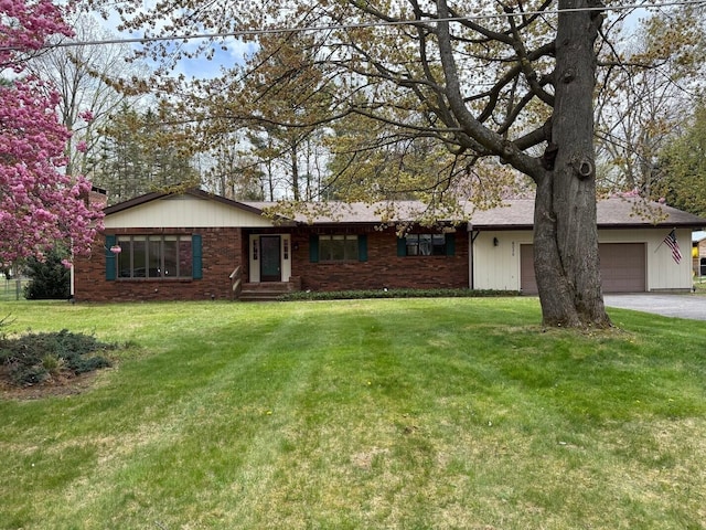 6035 W Trails End Rd, Ludington, MI 49431 - single story home with a garage, driveway, and a front yard