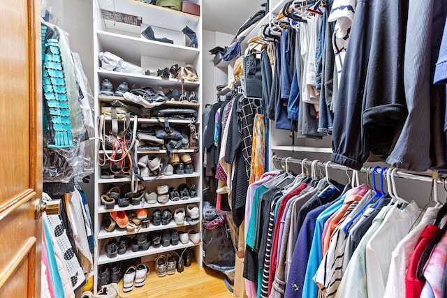 spacious closet featuring wood finished floors