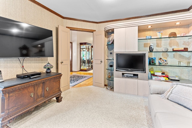 living room featuring ornamental molding and wallpapered walls