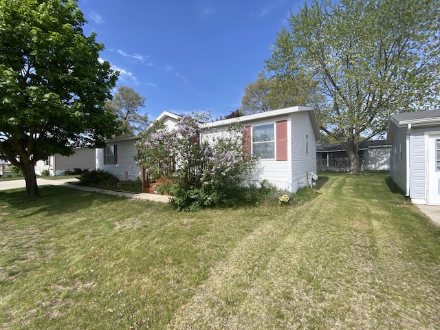 1966 Spyglass Trl, Muskegon, MI 49442 - view of front of home with a front yard