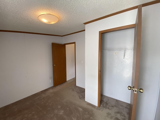 1966 Spyglass Trl, Muskegon, MI 49442 - unfurnished bedroom with ornamental molding, carpet, a closet, and a textured ceiling