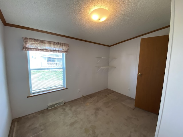 1966 Spyglass Trl, Muskegon, MI 49442 - carpeted spare room featuring crown molding, a textured ceiling, and vaulted ceiling