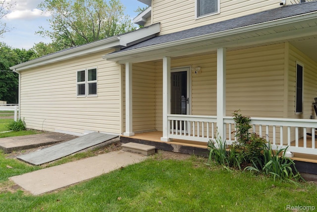 5160 N Milford Rd, Highland, MI 48356 - doorway to property with a porch, roof with shingles, and a yard