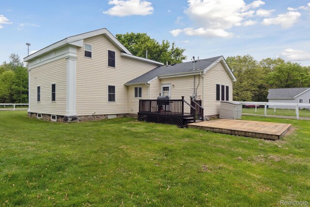 5160 N Milford Rd, Highland, MI 48356 - back of house with a wooden deck