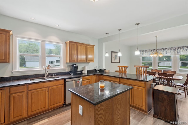 5160 N Milford Rd, Highland, MI 48356 - kitchen with stainless steel dishwasher, a sink, light wood-style floors, and plenty of natural light