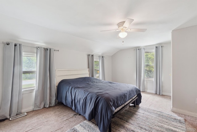 5160 N Milford Rd, Highland, MI 48356 - bedroom featuring multiple windows, vaulted ceiling, baseboards, light colored carpet, and a ceiling fan