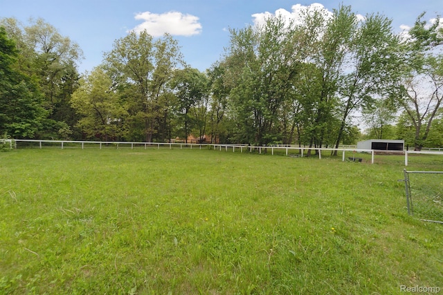 5160 N Milford Rd, Highland, MI 48356 - view of yard featuring an outbuilding and a view of rural / pastoral area