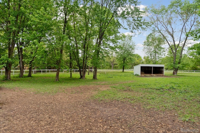 5160 N Milford Rd, Highland, MI 48356 - view of yard featuring a pole building, a detached carport, and an outdoor structure