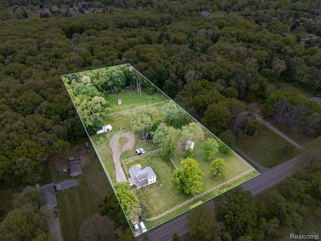 5160 N Milford Rd, Highland, MI 48356 - aerial view of property's location with property parcel outlined and a heavily wooded area