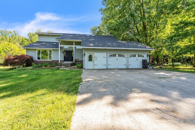 65505 M 43, Bangor, MI 49013 - view of front of home featuring a garage, driveway, a front lawn, and roof with shingles
