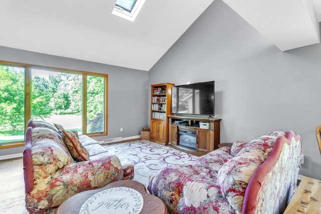 65505 M 43, Bangor, MI 49013 - living room with a skylight, high vaulted ceiling, light wood-style floors, and baseboards