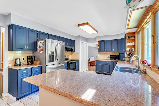 65505 M 43, Bangor, MI 49013 - kitchen featuring stainless steel appliances, a sink, open shelves, a peninsula, and decorative backsplash