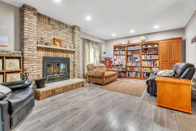 65505 M 43, Bangor, MI 49013 - living room with wood finished floors, a brick fireplace, and recessed lighting