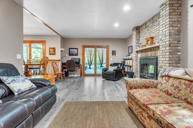 65505 M 43, Bangor, MI 49013 - living area featuring wood finished floors, a brick fireplace, and recessed lighting