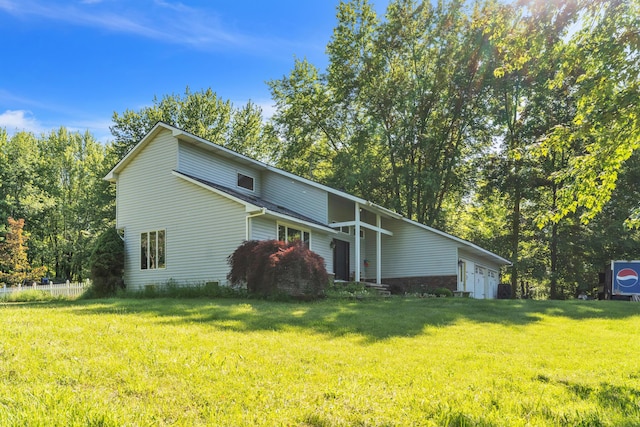 65505 M 43, Bangor, MI 49013 - view of side of home featuring a yard and an attached garage
