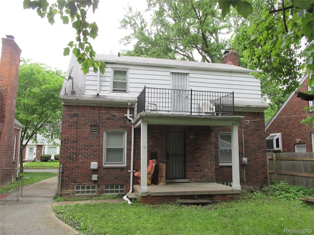 11356 Balfour Rd, Detroit, MI 48224 - back of property with a balcony, brick siding, a gate, and a chimney