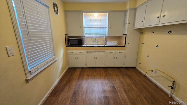 11356 Balfour Rd, Detroit, MI 48224 - laundry area with a sink, dark wood finished floors, and baseboards