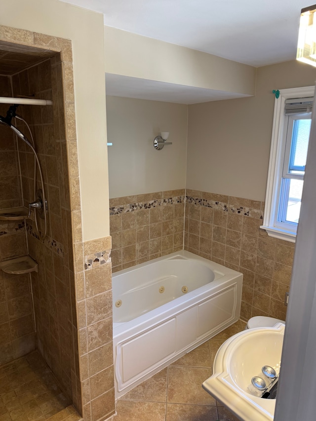 18259 Spring S, Fraser, MI 48026 - bathroom featuring a tile shower, tile patterned floors, a whirlpool tub, tile walls, and wainscoting