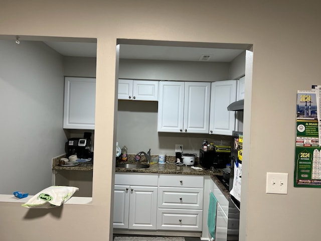4925 E 10 Mile Rd Unit 5, Warren, MI 48091 - kitchen with white cabinets, a sink, and dark countertops