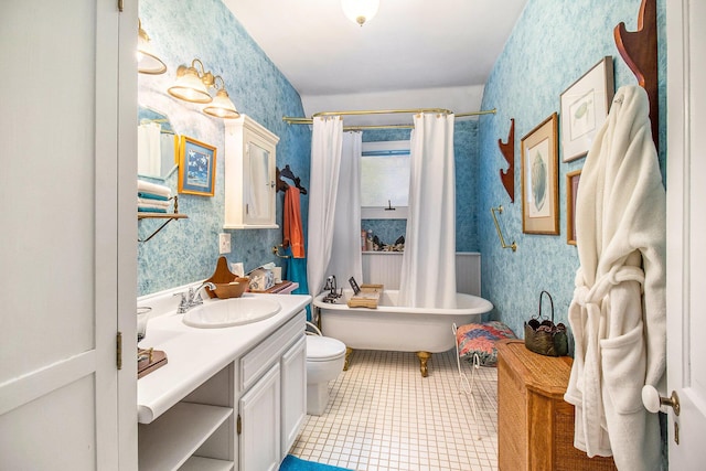 488 4th St, Manistee, MI 49660 - full bath with wallpapered walls, toilet, and vanity