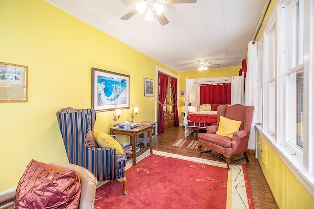488 4th St, Manistee, MI 49660 - living area with a ceiling fan and wood finished floors