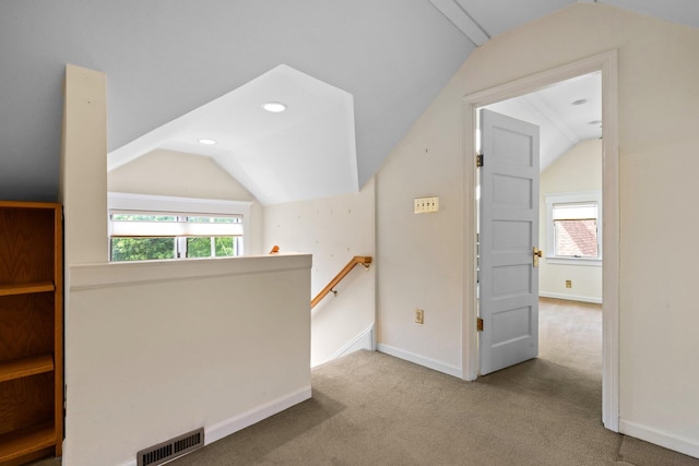 1054 Ferdon Rd, Ann Arbor, MI 48104 - hall featuring vaulted ceiling, an upstairs landing, baseboards, carpet floors, and healthy amount of natural light