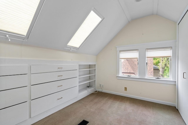 1054 Ferdon Rd, Ann Arbor, MI 48104 - bonus room with vaulted ceiling, light carpet, built in shelves, baseboards, and attic access