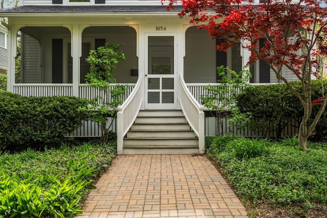 1054 Ferdon Rd, Ann Arbor, MI 48104 - view of exterior entry featuring covered porch and a shingled roof