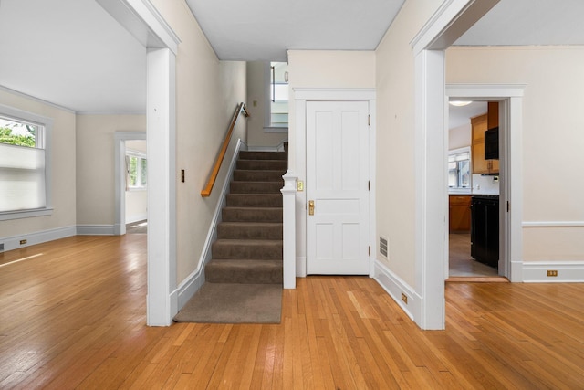 1054 Ferdon Rd, Ann Arbor, MI 48104 - staircase with hardwood / wood-style flooring and baseboards