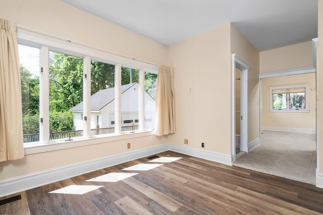 1054 Ferdon Rd, Ann Arbor, MI 48104 - spare room with wood finished floors and baseboards