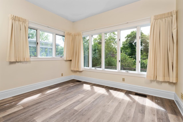 1054 Ferdon Rd, Ann Arbor, MI 48104 - empty room featuring baseboards and wood finished floors