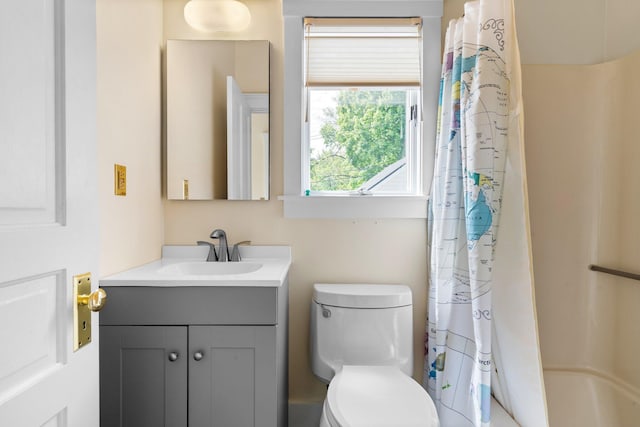 1054 Ferdon Rd, Ann Arbor, MI 48104 - bathroom featuring vanity, toilet, and shower / tub combo with curtain