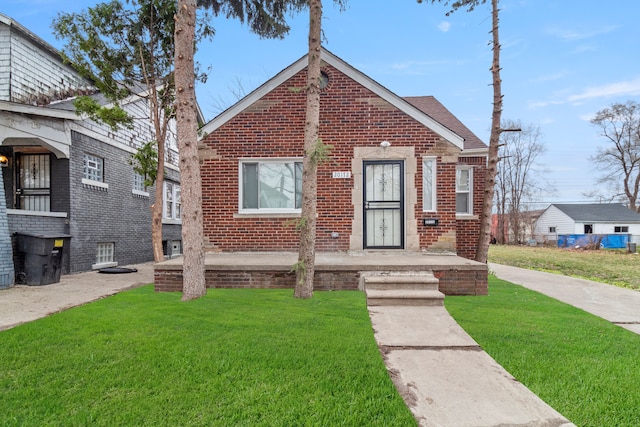 20172 Stotter St, Detroit, MI 48234 - bungalow featuring a front yard and brick siding