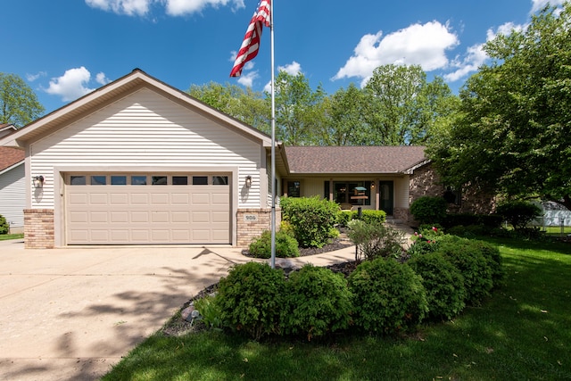 906 Village Dr, Davison, MI 48423 - ranch-style house featuring brick siding, driveway, a garage, and a front lawn