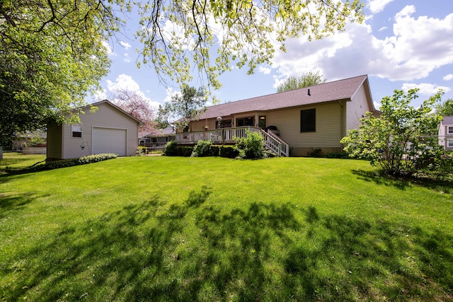 906 Village Dr, Davison, MI 48423 - view of green lawn with an outbuilding, a wooden deck, a detached garage, and stairway