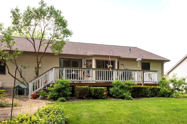 906 Village Dr, Davison, MI 48423 - back of house featuring a lawn, a wooden deck, and a shingled roof