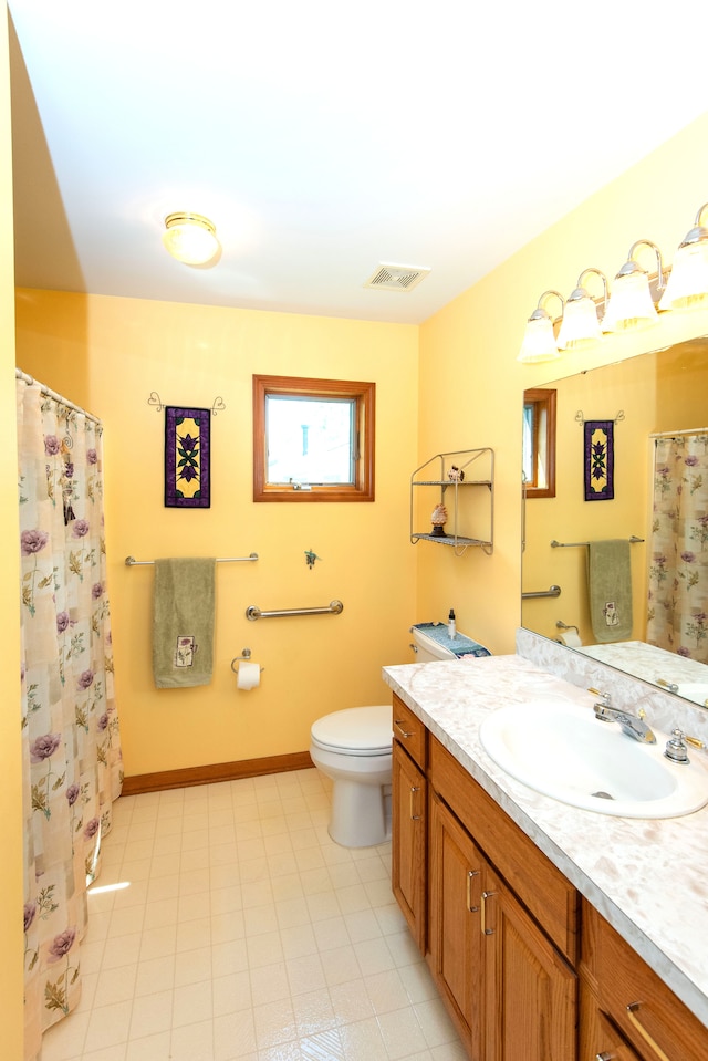 906 Village Dr, Davison, MI 48423 - bathroom with toilet and vanity
