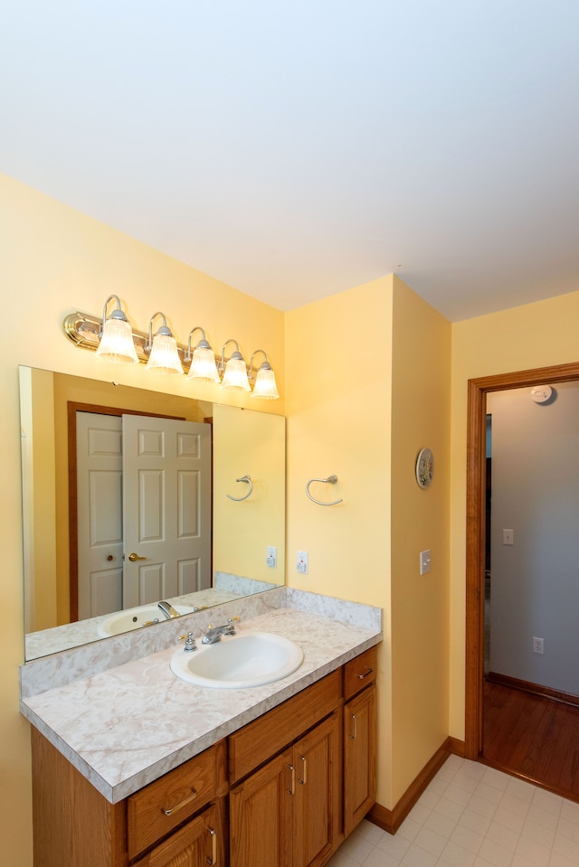 906 Village Dr, Davison, MI 48423 - bathroom featuring vanity and baseboards