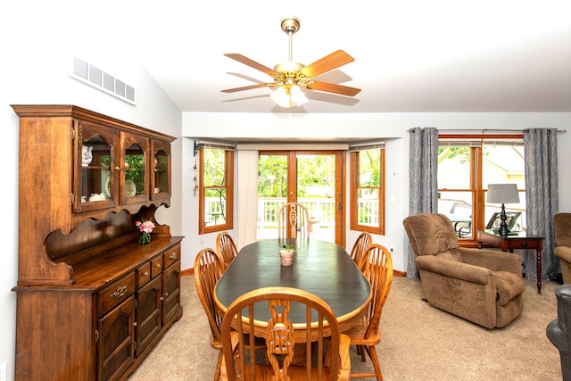 906 Village Dr, Davison, MI 48423 - dining area with ceiling fan, light colored carpet, baseboards, and lofted ceiling