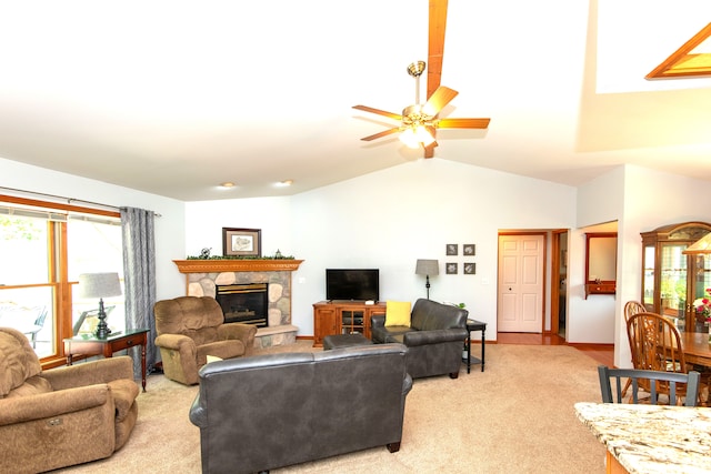 906 Village Dr, Davison, MI 48423 - living area with a fireplace, ceiling fan, healthy amount of natural light, vaulted ceiling, and carpet flooring