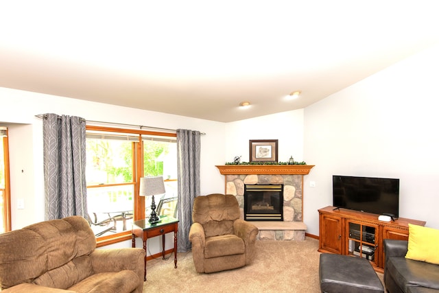 906 Village Dr, Davison, MI 48423 - living area featuring carpet flooring, a stone fireplace, baseboards, and vaulted ceiling