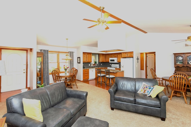 906 Village Dr, Davison, MI 48423 - living room with a ceiling fan and vaulted ceiling