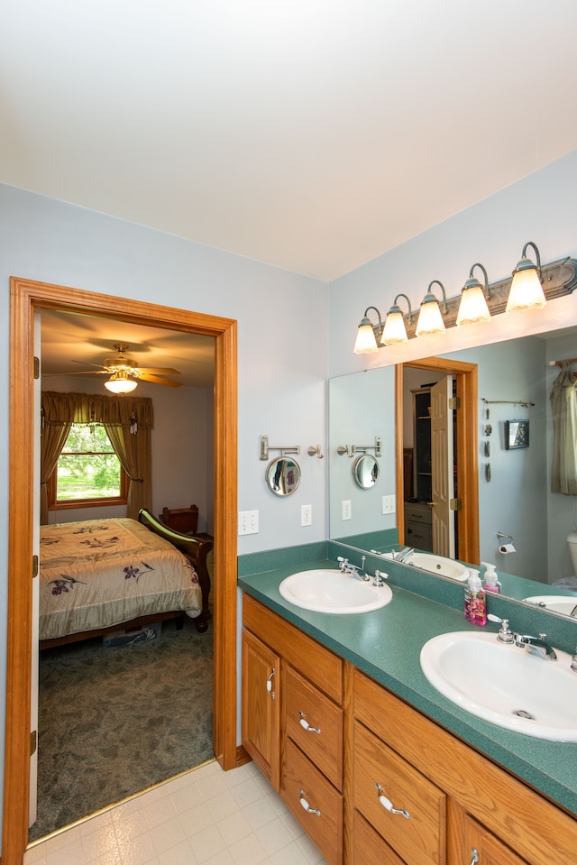 906 Village Dr, Davison, MI 48423 - bathroom featuring ensuite bathroom, double vanity, and a ceiling fan