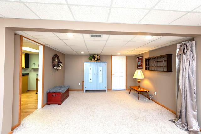 906 Village Dr, Davison, MI 48423 - sitting room featuring carpet floors, baseboards, and a drop ceiling