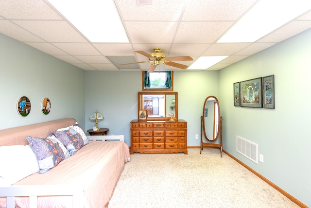 906 Village Dr, Davison, MI 48423 - carpeted bedroom with a drop ceiling, ceiling fan, and baseboards