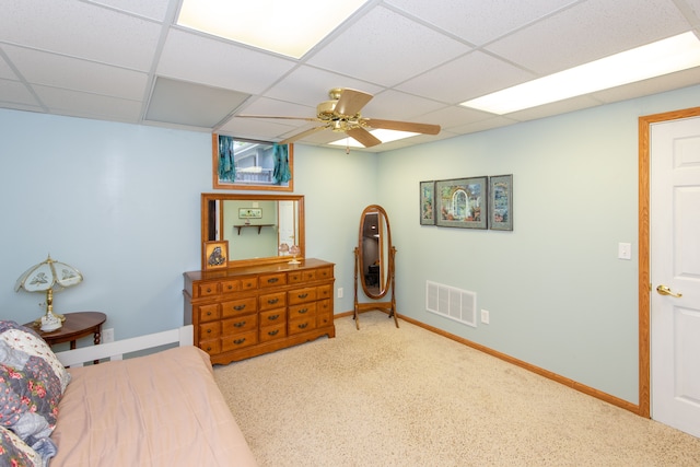 906 Village Dr, Davison, MI 48423 - carpeted bedroom featuring a drop ceiling, baseboards, and ceiling fan