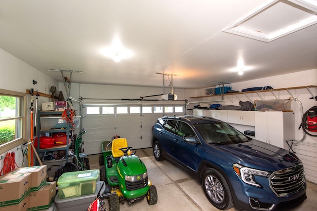 906 Village Dr, Davison, MI 48423 - garage with a garage door opener