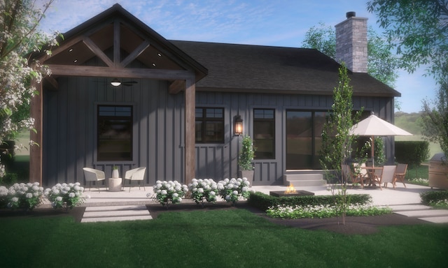11433 Marshall, South Lyon, MI 48178 - rear view of house featuring a chimney, board and batten siding, a shingled roof, a patio, and a fire pit