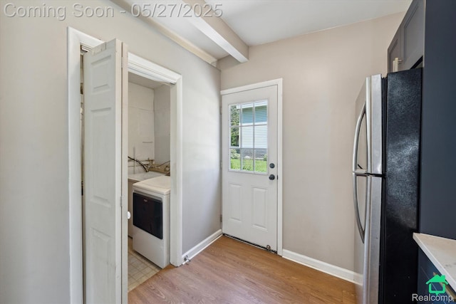 243 Reno St, Lake Orion, MI 48362 - doorway featuring washer / clothes dryer, light wood-style flooring, beam ceiling, and baseboards