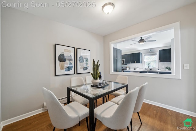 243 Reno St, Lake Orion, MI 48362 - dining room with wood finished floors, baseboards, and a ceiling fan